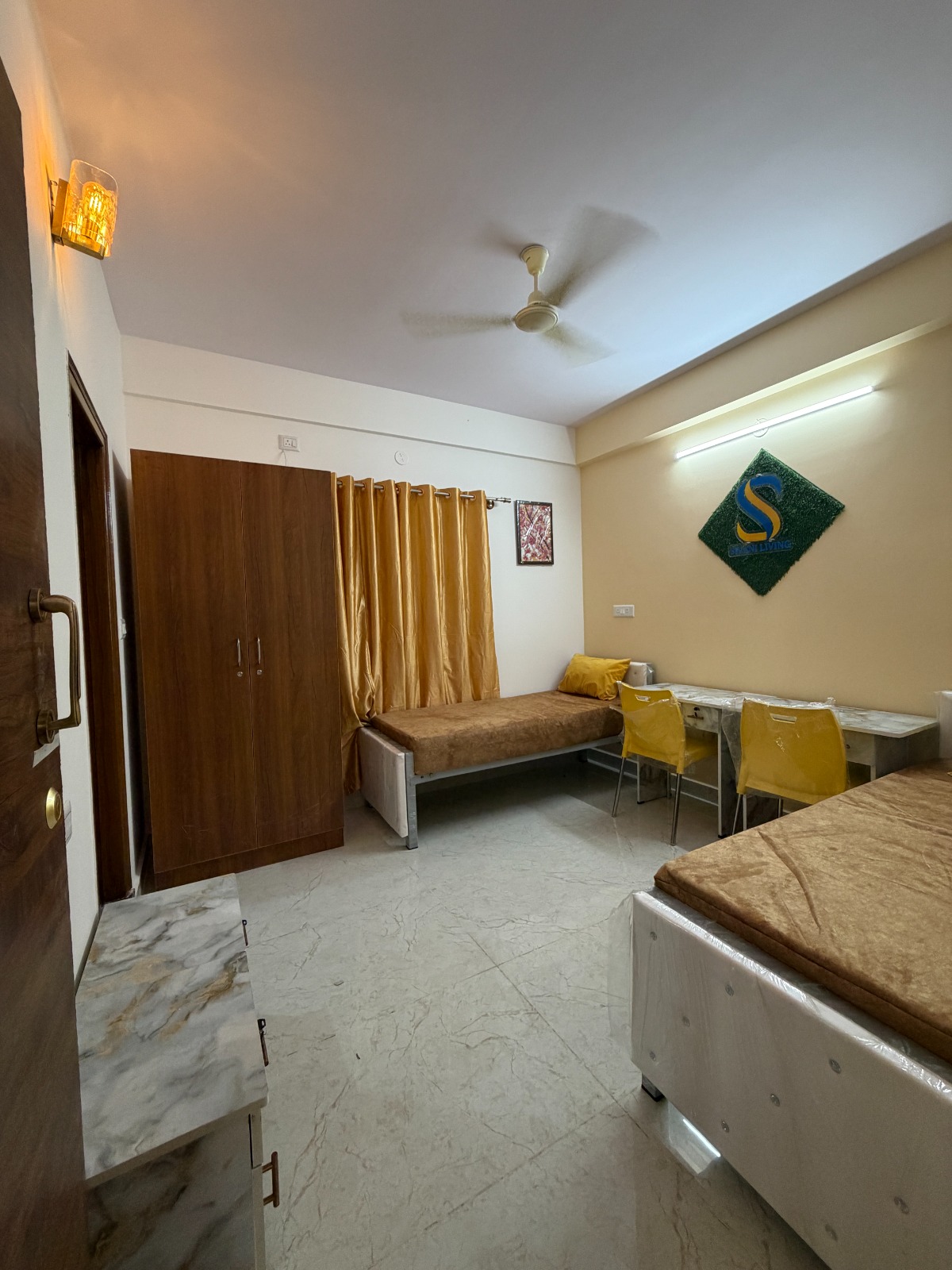 Mari Gold room in BTM Layout Bangalore with premium furnishings and clean interiors — PG photo 1 of 4 Mari Gold room in BTM Layout Bangalore with premium furnishings and clean interiors — PG photo 1 of 4